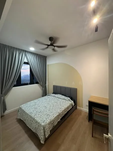 Bedroom features: queen-size bed with patterned bedding, upholstered headboard, wooden flooring, floor-to-ceiling window, grey curtains, 5-blade ceiling fan with light, study desk, wooden chair, accent wall with arch design, decorative wall lighting; style: modern; view: city.