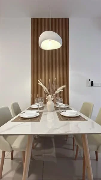 Dining features: white dining table with glossy finish, light grey upholstered dining chairs, wooden accent wall with vertical slats, pendant light fixture, decorative vase with dried flowers, table setting with plates and glasses, neutral-colored table runner, tile flooring; style: modern.