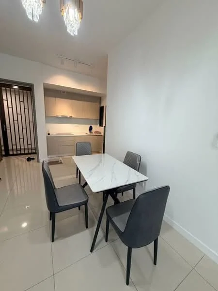 Dining features: marble dining table, 4 upholstered dining chairs in grey, white painted walls, glossy tile flooring, recessed ceiling lights, pendant lights, open kitchen view, built-in cabinetry in kitchen, kitchen countertop, kitchen appliances visible; style: modern; view: kitchen.