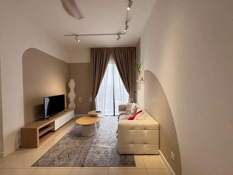 Living features: white painted walls, beige accent wall, floor-to-ceiling windows, sheer curtains, 3-seater fabric sofa in white, red accent pillows, round wooden coffee table, area rug with geometric pattern, TV console, wall-mounted TV, 5-blade ceiling fan with light, decorative plant on shelf; style: modern; view: city.
