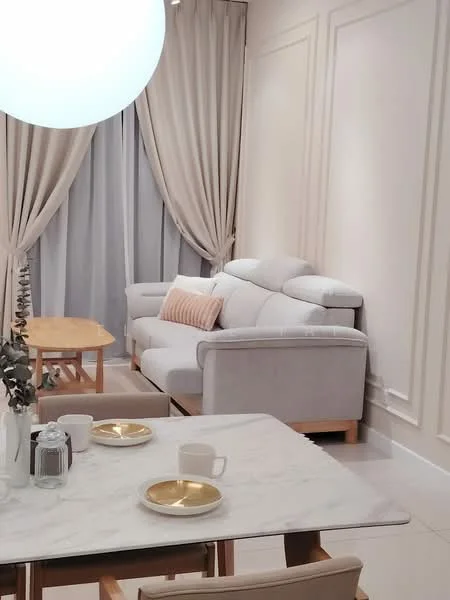 Living features: light grey fabric sofa, wooden coffee table, white marble dining table, cream curtains, floor-to-ceiling windows, decorative throw pillow, ceramic cups, gold-rimmed plates, wall paneling, recessed lighting, pendant light fixture; style: modern.