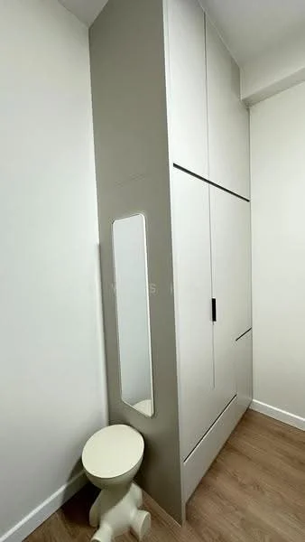 Room features: built-in wardrobe with sliding doors, full-length mirror, light wood flooring, neutral painted walls, minimalist design, small stool, corner layout; style: modern.