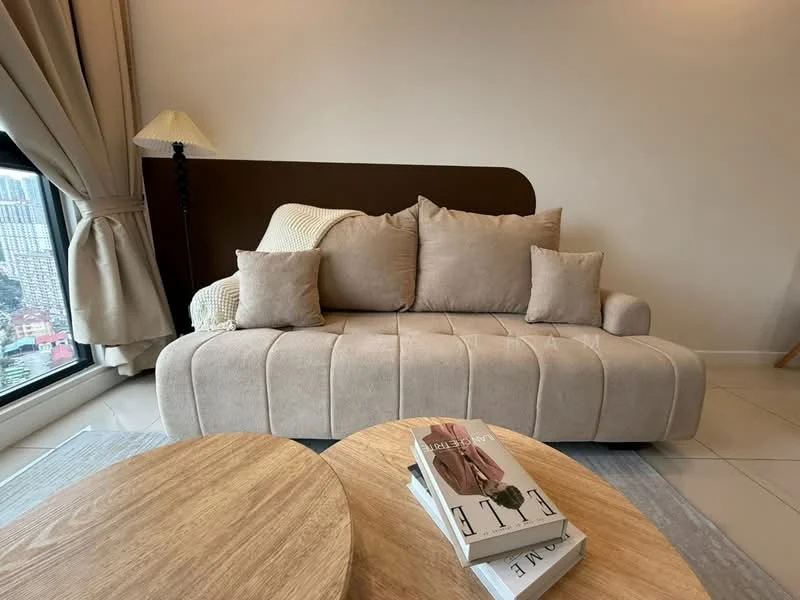 Living features: beige fabric sofa with two cushions, wooden coffee table, round coffee table, floor-to-ceiling window, curtains, lampshade, neutral wall color, tile flooring; style: modern; view: city.