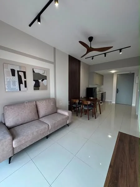 Living features: 3-seater fabric sofa in light beige, wall-mounted artwork with abstract design, white painted walls, recessed downlights, 5-blade ceiling fan with light, glossy ceramic tile flooring, dining table with four chairs, kitchen area visible in background, wooden accent wall, open layout; style: modern.