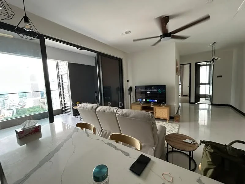 Living features: 3-seater fabric sofa in white, wooden coffee table, wall-mounted TV, ceiling fan, floor-to-ceiling windows, city view, marble flooring, decorative wall light, area rug with geometric pattern; style: modern; view: city. Kitchen features: marble countertop, stainless-steel sink, kitchen island with seating, bar stools, built-in cabinetry; style: modern.