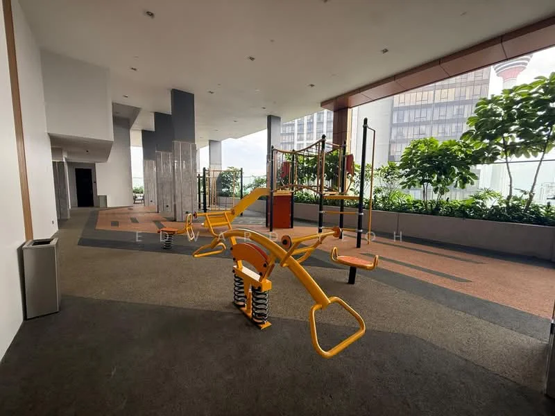 Exterior type: clubhouse; features: outdoor gym equipment, yellow exercise machines, rubber flooring, landscaped greenery, large windows, open space, modern design, covered area; style: modern.