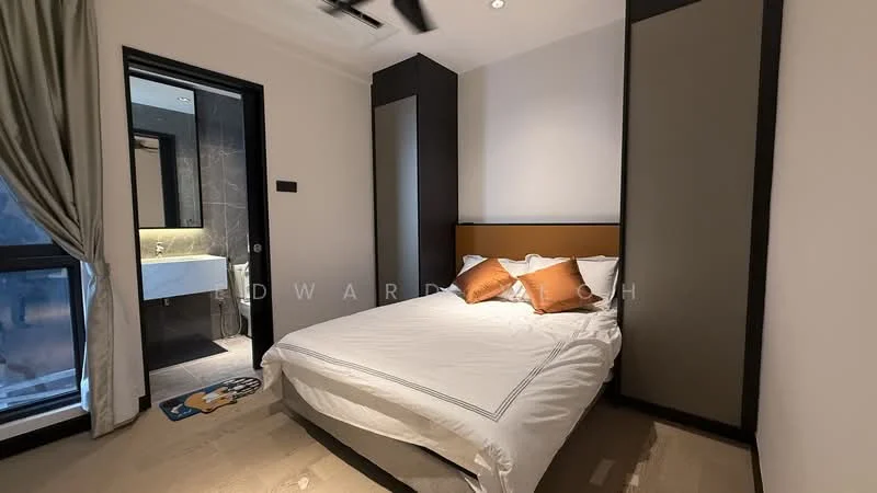Bedroom features: queen-size bed with white bedding, upholstered headboard, two decorative pillows in orange, wooden flooring, built-in wardrobe with sliding doors, wall-mounted ceiling fan, window with sheer curtains, light-colored walls, recessed ceiling lights; style: modern. Bathroom features: vanity with under-sink storage, white countertop, mirror above the vanity, toilet, grey tiled walls, grey tiled flooring; style: modern.