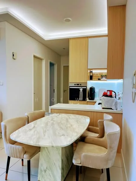 Dining features: marble dining table with unique base, 4 upholstered dining chairs in beige, wood cabinetry with light finish, built-in oven, stainless-steel fridge, kitchen countertop with under-cabinet lighting, white backsplash, recessed ceiling lights, floor-to-ceiling cabinet, open shelving for decor, neutral wall color, tile flooring; style: modern.