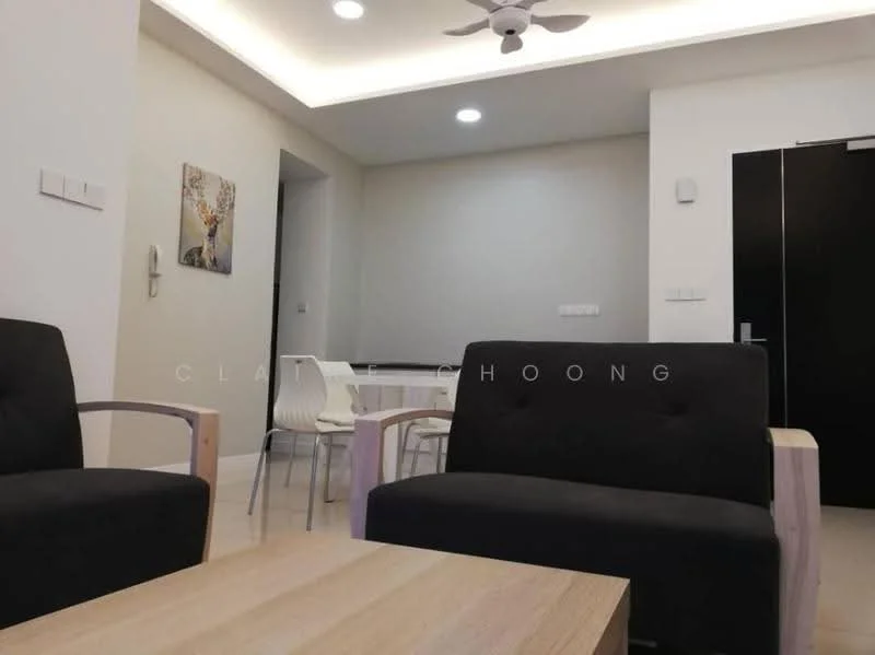 Living features: 2 black fabric sofas, wooden armrests on sofas, light wood coffee table, recessed ceiling lights, ceiling fan, light-colored walls, laminate flooring, dining area visible in background, white dining chairs, black door, intercom on wall; style: modern.