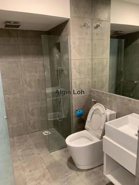 Bathroom features: grey tiled walls, grey tiled flooring, glass shower enclosure, rain shower head, handheld shower, single-sink vanity with white cabinet, chrome basin mixer, framed mirror, one-piece toilet, toilet paper holder, wall-mounted light fixtures; style: modern.