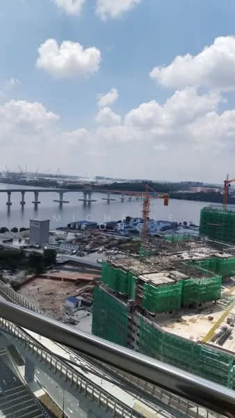 Exterior type: high-rise condominium; features: city skyline view, construction cranes, waterfront, green construction netting, river view, urban landscape, surrounding construction sites; style: modern.