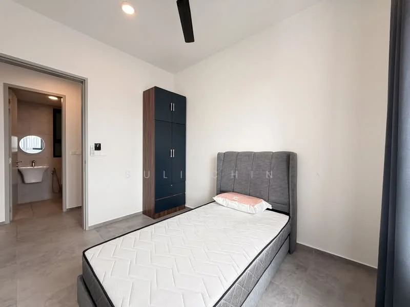 Bedroom features: queen-size bed, upholstered headboard, grey bed frame, single pillow on bed, built-in wardrobe with blue cabinetry, grey tiled flooring, white painted walls, ceiling fan, window with grey curtains, light fixture on ceiling; style: modern. Bathroom features: toilet, sink, tile flooring, wall-mounted mirror, shower area, white tiled walls.