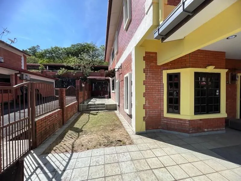 Exterior type: semi-detached house; features: red brick facade, yellow painted accents, paved walkway, manicured lawn, fenced garden area, windows with black frames, covered carport, surrounded by greenery; style: modern.