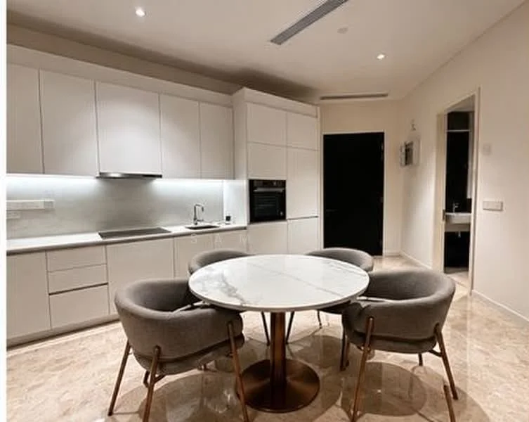 Kitchen features: white cabinetry with flat-panel doors, marble countertop, stainless-steel sink, chrome pull-down faucet, built-in oven, recessed LED downlights, grey upholstered dining chairs, round dining table with marble top, cream marble flooring, wall-mounted kitchen appliances; style: modern.