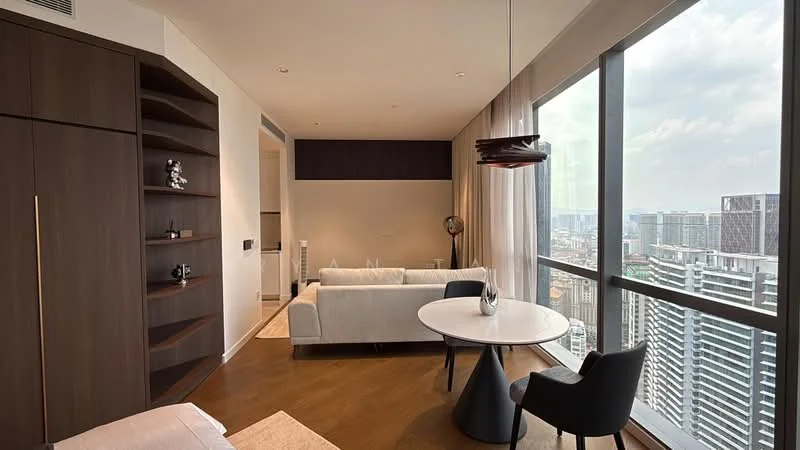 Living features: floor-to-ceiling windows, light wood flooring, white fabric sofa, round dining table, black dining chairs, dark wood shelving unit, pendant light fixture, decorative sculpture, city skyline view; style: modern; view: city.
