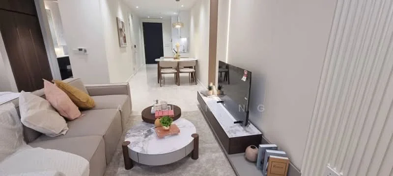 Living features: light grey fabric sofa, decorative cushions in pink and cream, round coffee table with marble top, wooden base for coffee table, wall-mounted TV, TV console with marble surface, decorative items on console, recessed ceiling lights, neutral wall colour, white tiled flooring, dining area visible in background, dining table with two chairs; style: modern.