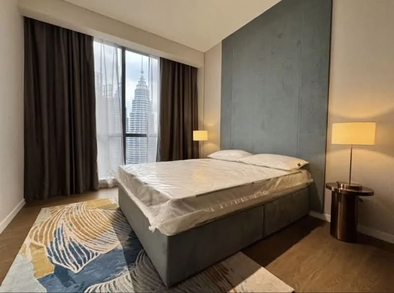 Bedroom features: king-size bed with mattress protector, upholstered headboard, bedside lamps, floor-to-ceiling windows, curtains, area rug with abstract pattern, wooden flooring, decorative wall paneling; style: modern; view: city.