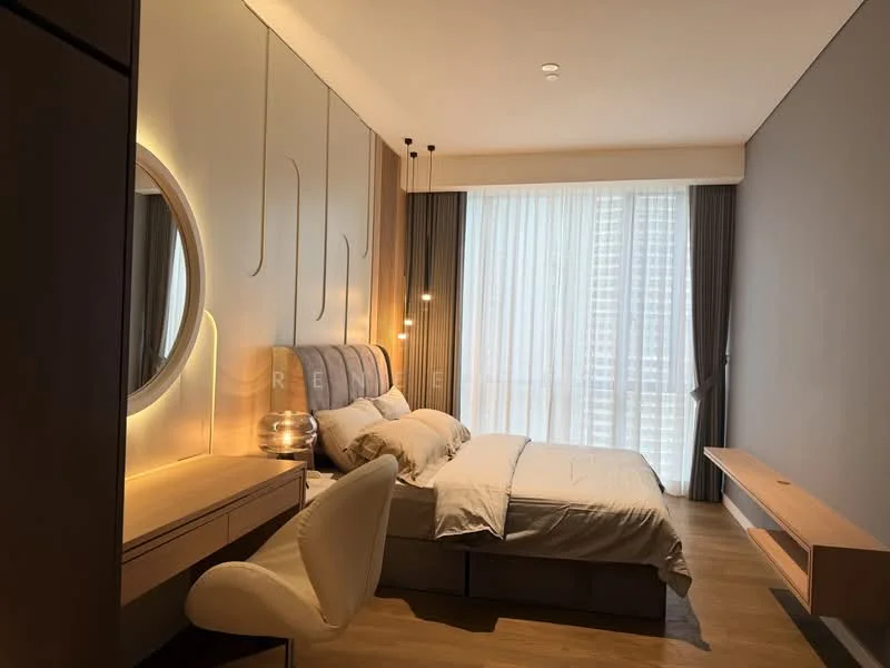 Bedroom features: queen-size bed, upholstered headboard, bedside lamps, built-in wardrobe, study desk, chair, wooden flooring, floor-to-ceiling windows with sheer curtains, decorative wall lighting, wall-mounted shelf, neutral wall color, soft bedding; style: modern; view: city.
