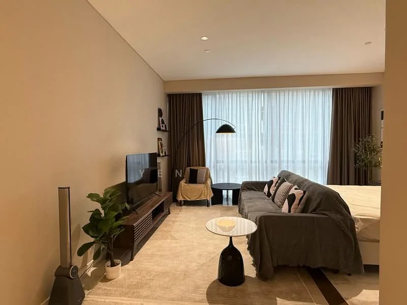 Living features: grey fabric sofa, black coffee table, TV console, wall-mounted TV, area rug, floor-to-ceiling windows, sheer curtains, dark brown curtains, decorative plant, lamp with arching arm, light-colored walls, recessed ceiling lights; style: modern.