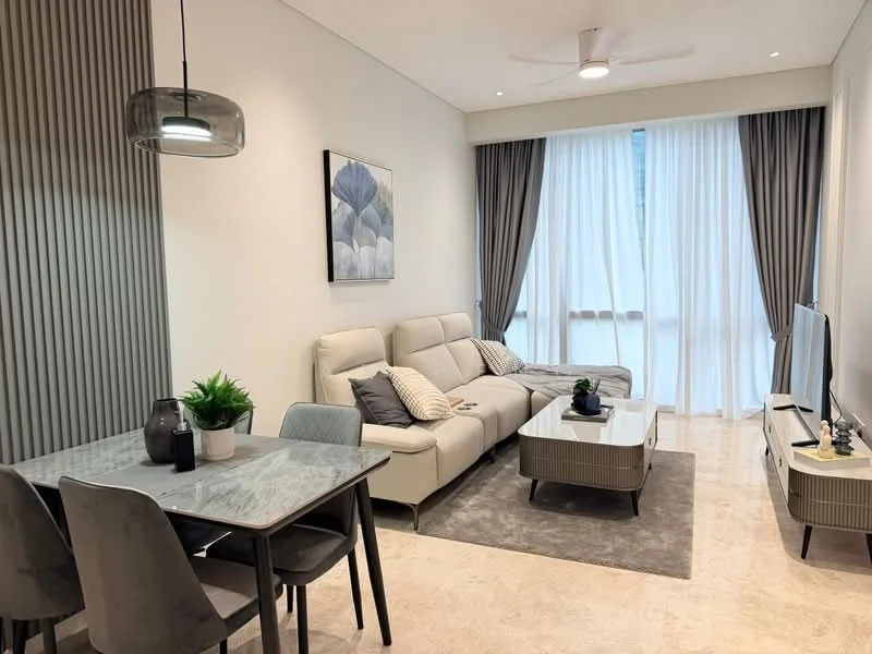 Living features: 3-seater fabric sofa in light grey, 2 accent cushions on sofa, coffee table with glass top and grey base, area rug in neutral tones, wall-mounted TV, TV console in light wood finish, ceiling fan with light, floor-to-ceiling windows with sheer curtains, decorative wall art with floral design, potted plant on coffee table, dining table with 4 chairs in grey, wall paneling with vertical lines; style: modern.