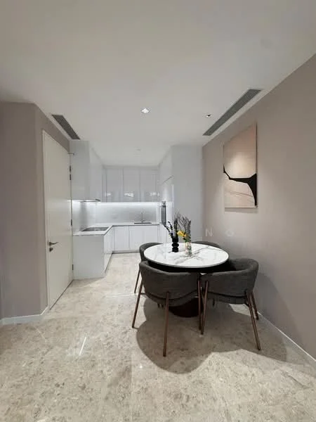 Kitchen features: white cabinetry, marble countertop, stainless-steel sink, built-in oven, freestanding range oven, recessed downlights, marble tile flooring, round dining table, upholstered dining chairs, decorative wall art; style: modern.