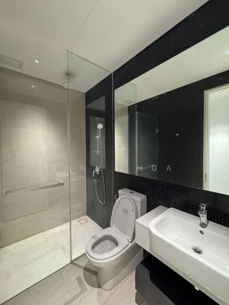 Bathroom features: walk-in shower with glass enclosure, rain shower head, handheld shower, single-sink vanity with white cabinet, chrome basin mixer, toilet, tile flooring, black accent wall, mirrored wall, recessed downlights; style: modern.