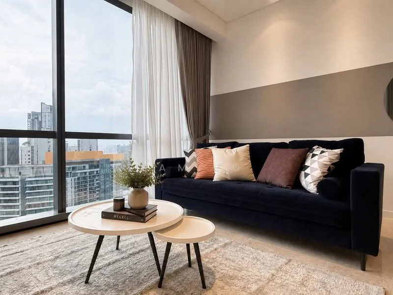 Living features: black fabric sofa, decorative cushions in various colors, round coffee table with white top and black legs, area rug with neutral color, floor-to-ceiling windows, sheer curtains, grey accent wall, city skyline view; style: modern; view: city.
