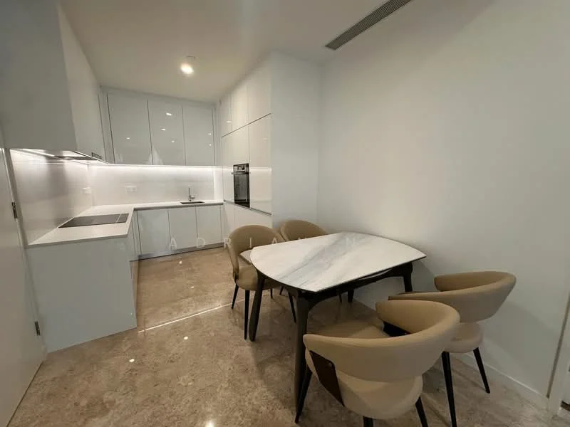 Kitchen features: white cabinetry, marble countertop, built-in oven, stainless-steel fridge, ceramic cooktop, white backsplash, recessed downlights, single-bowl stainless-steel sink, chrome pull-down faucet; style: modern. Dining features: 6-seater dining table with marble top, upholstered dining chairs in beige, polished stone flooring, white painted walls, recessed lighting; style: modern.