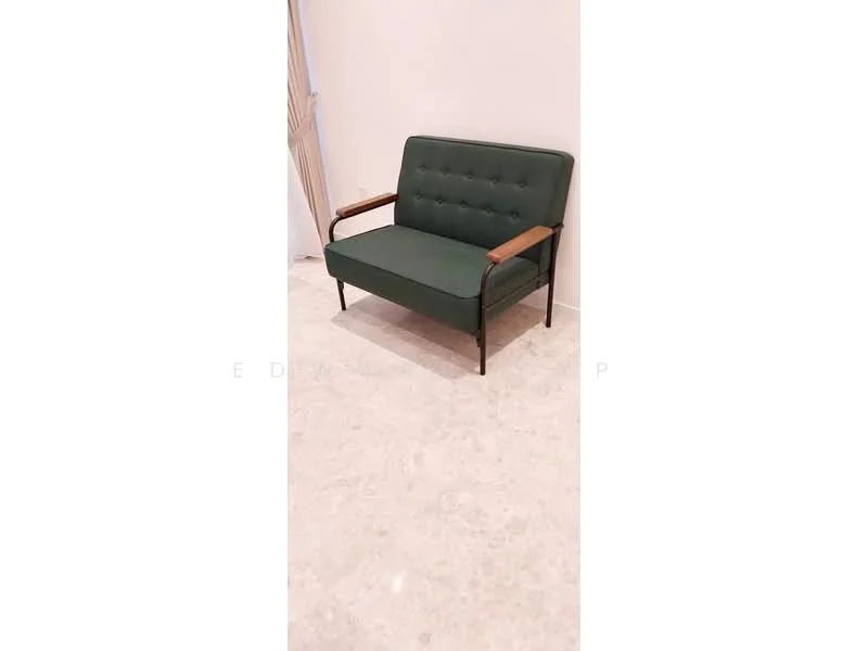 Room features: green fabric sofa, wooden armrests, metal frame, tufted upholstery, marble flooring, white painted walls; style: modern.