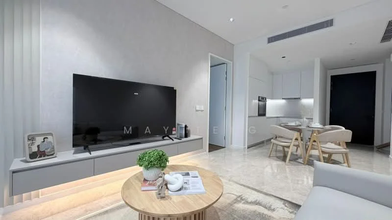 Living features: large flat-screen TV on wall-mounted console, light grey sofa, round wooden coffee table, marble flooring, recessed ceiling lights, white vertical blinds, decorative plant on console, open layout to kitchen-dining area; style: modern. Dining features: round dining table, four wooden dining chairs, white cabinetry in background, built-in kitchen appliances visible; style: modern.