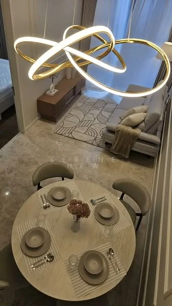Dining features: round dining table, marble tabletop, 4 dining chairs, decorative vase with flowers, table setting with plates and cutlery, pendant light fixture, grey upholstered sofa, textured area rug, wooden sideboard, curtains, wall with decorative paneling; style: modern.