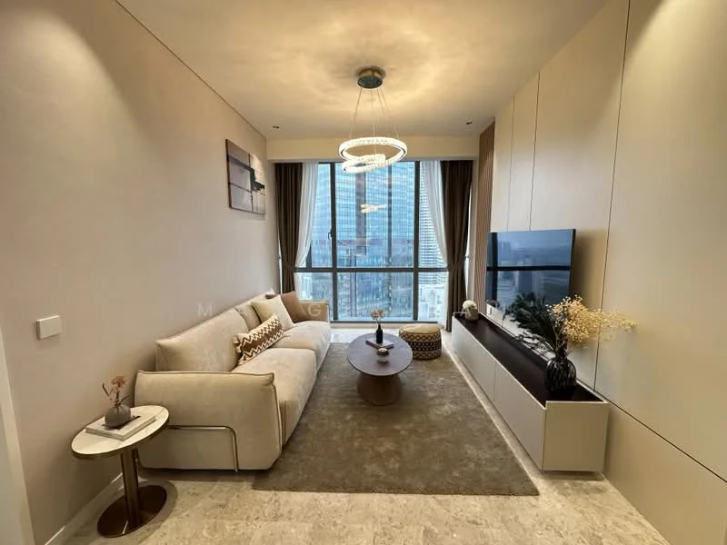 Living features: beige fabric 3-seater sofa, round wooden coffee table, TV console with storage, wall-mounted TV, chandelier with circular design, floor-to-ceiling windows, curtains in neutral color, decorative vase with dried flowers, area rug in light color, light-colored wall panels, marble flooring, accent wall with artwork; style: modern; view: city.