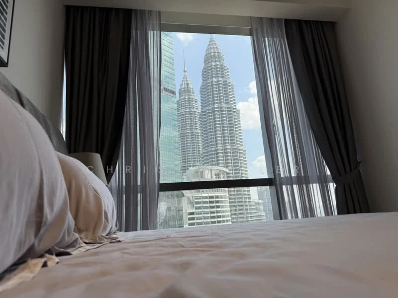 Bedroom features: king-size bed, floor-to-ceiling windows, grey curtains, white bedding, decorative pillows, nightstand, lamp on nightstand, view of city skyline; style: modern; view: city.