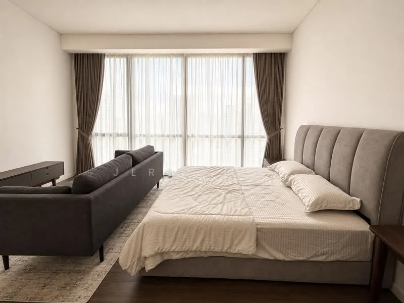 Bedroom features: king-size bed with upholstered headboard, white bedding, grey fabric sofa, wooden side table, floor-to-ceiling windows, sheer curtains, dark curtains, wooden flooring, area rug with neutral pattern; style: modern; view: city.
