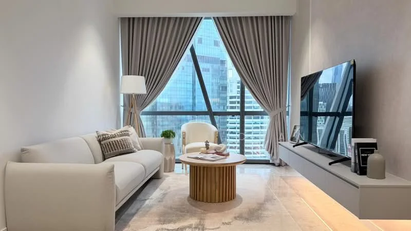Living features: light grey fabric 3-seater sofa, round coffee table with wooden base, wall-mounted TV, TV console, floor-to-ceiling windows, sheer curtains, decorative vase on table, area rug with neutral tones, accent chair in white, decorative throw pillows; style: modern; view: city.
