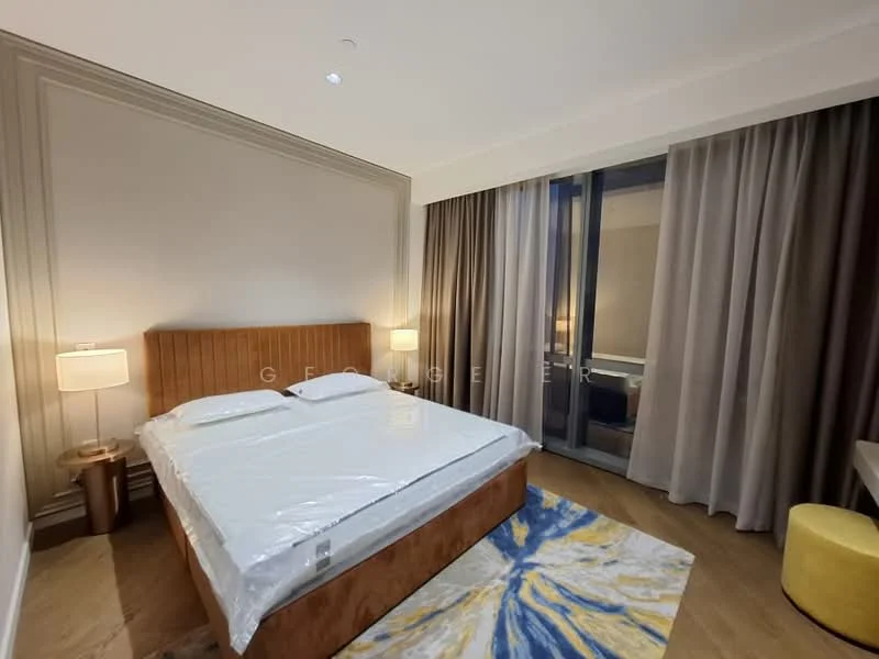 Bedroom features: king-size bed with upholstered headboard, two bedside lamps, floor-to-ceiling windows, sheer curtains, dark wood flooring, decorative area rug with abstract pattern, wall with crown moulding, built-in wardrobe, recessed ceiling lights; style: modern.