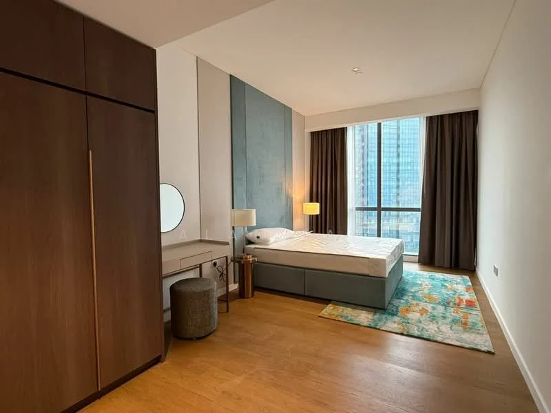 Bedroom features: king-size bed, upholstered headboard, wooden flooring, built-in wardrobe with sliding doors, dressing table with round mirror, table lamp, floor-to-ceiling windows, sheer curtains, area rug with colorful pattern; style: modern; view: city.