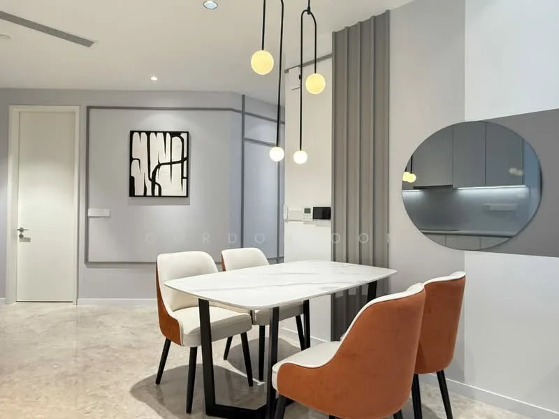 Dining features: marble dining table, 4 upholstered dining chairs in orange, pendant lighting with three globes, grey accent wall, white walls, round mirror on wall, framed artwork on wall, recessed lighting, open layout to kitchen, textured wall paneling; style: modern.