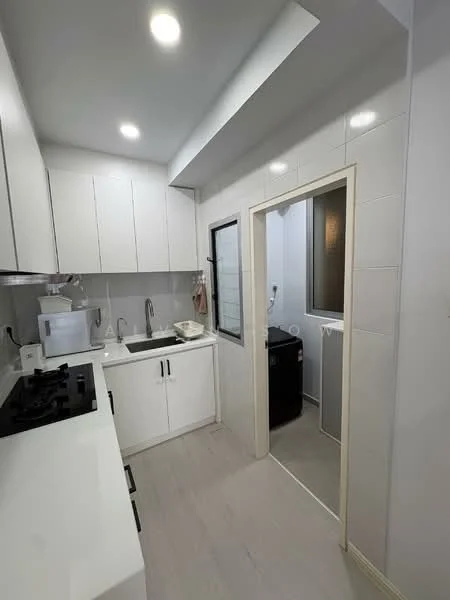 Kitchen features: white shaker cabinets, stainless-steel sink, chrome pull-down faucet, white quartz countertop, built-in gas hob, built-in oven, microwave, tile backsplash, recessed LED downlights, light grey laminate flooring, floor-to-ceiling cabinets, window with black frame, open layout to laundry area; style: modern. Laundry features: front-load washing machine, black dryer, tile flooring, window for natural light.