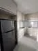 Kitchen features: black stainless-steel fridge, white cabinetry, grey countertop, tile backsplash, double-bowl stainless-steel sink, chrome pull-down faucet, built-in oven, ceramic tile flooring, recessed downlights, window with natural light; style: modern.