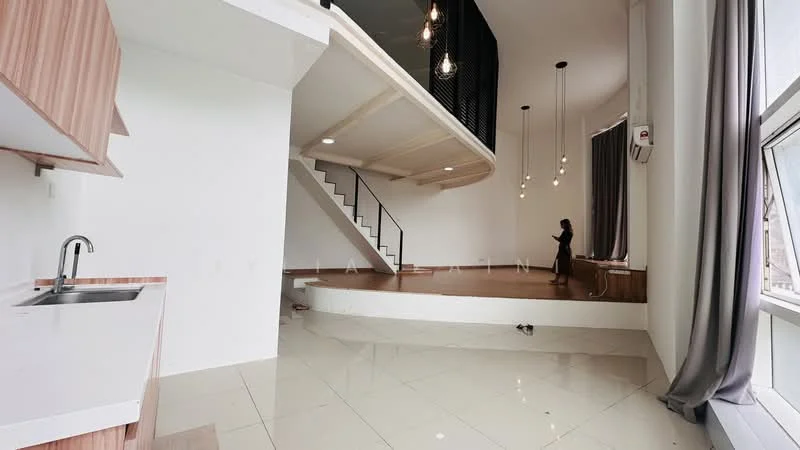Kitchen features: single-bowl stainless-steel sink, white countertop, wood cabinetry; style: modern. Living features: open layout, high ceiling, wooden flooring, large windows, hanging pendant lights, staircase with black railing, curtains, platform area; style: modern.