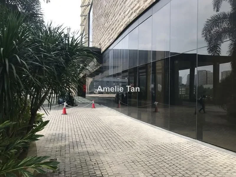 Exterior features: glass facade, paved walkway, landscaped greenery, potted plants, traffic cones, urban context, surrounding buildings visible; style: modern.