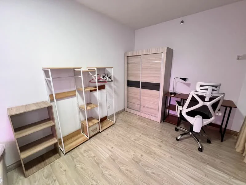 Room features: light wood laminate flooring, white painted walls, built-in wardrobe with sliding doors, wooden shelving unit, open clothing rack, study desk, ergonomic office chair; style: modern.