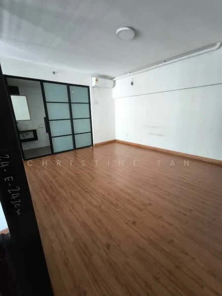 Room features: laminate flooring, white painted walls, ceiling light, wall-mounted split AC, glass sliding door, open layout, baseboard, no visible furniture; style: modern.