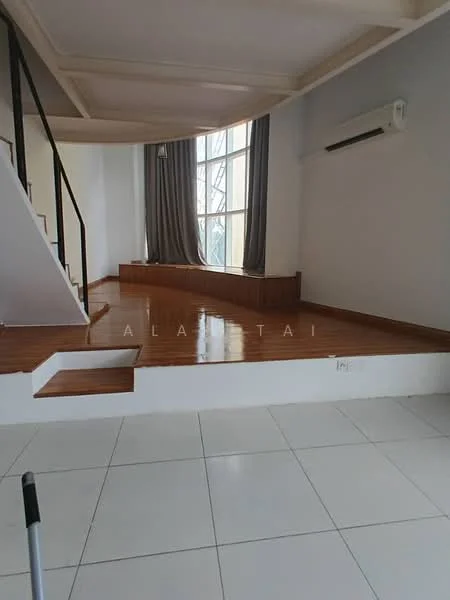 Room features: wooden flooring, white painted walls, large windows with sheer curtains, air conditioning unit, tray ceiling, staircase with black railing, platform area with wooden paneling, tile flooring, natural light from windows; style: modern.