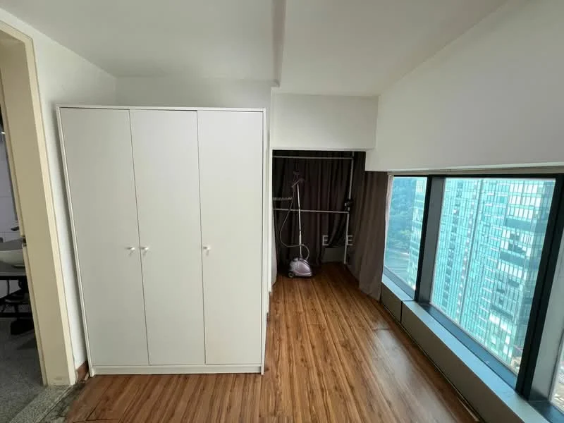 Room features: white built-in wardrobe with sliding doors, large floor-to-ceiling windows, wood laminate flooring, curtains, city skyline view, hanging clothes rack, minimalist decor, neutral wall color; style: modern; view: city.