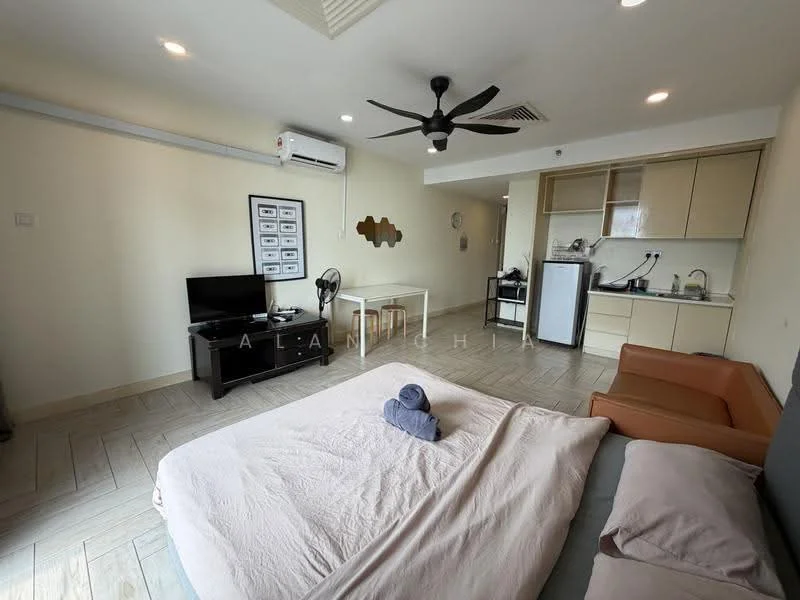 Room features: queen-size bed, upholstered headboard, light-colored bedding, 3-seater fabric sofa in orange, coffee table, wall-mounted TV, black TV console, air conditioning unit, ceiling fan, kitchenette with cabinets, stainless-steel fridge, built-in oven, sink, countertop, tile flooring; style: modern.