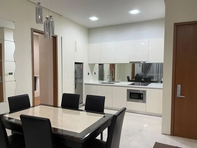 Dining features: 6-seater dining table with marble top, upholstered dining chairs in black, pendant lighting with multiple bulbs, white painted walls, marble flooring, built-in cabinetry with glossy white finish, stainless-steel fridge, built-in microwave, sink with chrome faucet, countertop with white surface, mirror on wall, recessed ceiling lights; style: modern. Kitchen features: white cabinetry with flat-panel doors, stainless-steel appliances, countertop with white surface, built-in microwave, sink with chrome faucet, recessed ceiling lights; style: modern.