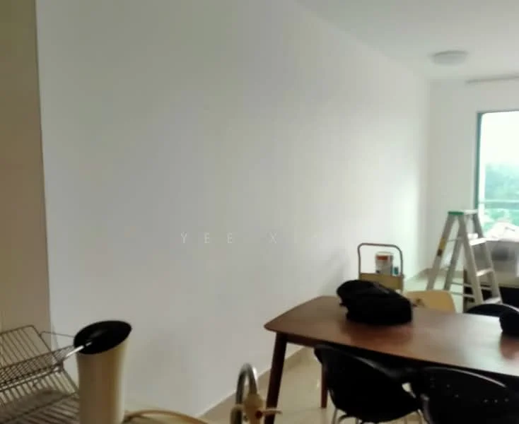 Room features: white painted walls, wooden table, black chairs, window with natural light, flooring visible, kitchen utensils on table, ladder, unmade bed visible in background.