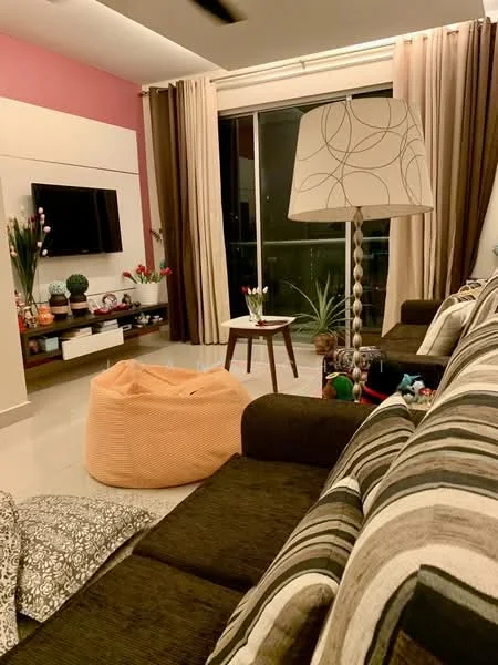 Living features: sofa with striped upholstery, bean bag chair in orange, coffee table, floor lamp with patterned shade, wall-mounted TV, decorative plants on shelves, curtains in brown and cream, accent wall in pink, area rug, decorative cushions with various patterns, glass sliding door, tile flooring; style: contemporary; view: garden.